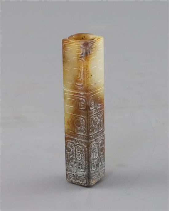 A Chinese archaistic white and russet jade handle mount, H. 9.7cm